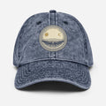 Vintage dad hat with woodcut flat earth firmament design showing stationary earth, sun and moon under protective dome